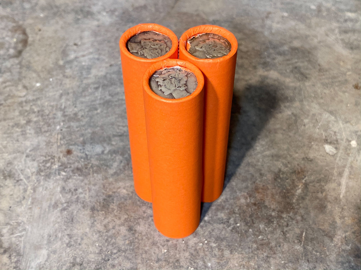 SILVER MERCURY DIME showing on end of orange unsearched old wheat penny roll us coins estate collection cent sale pennies lot hoard