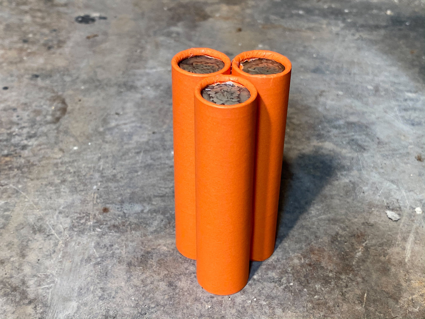 SILVER MERCURY DIME showing on end of orange unsearched old wheat penny roll us coins estate collection cent sale pennies lot hoard